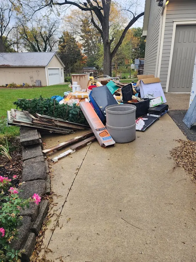 Dumpster being loaded with debris for Roofing Dumpster Rental in Layhill